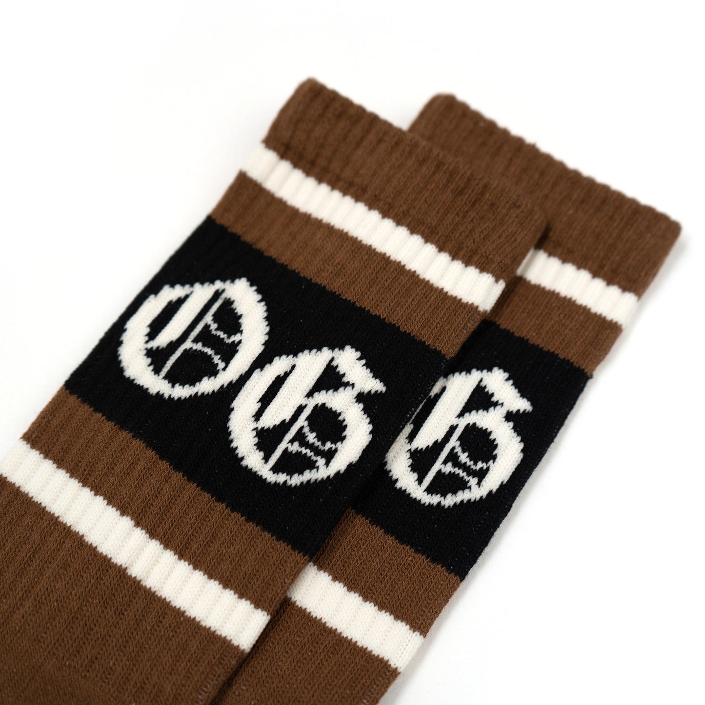 Mocha coloured OG socks with black and white stripes and white OG logo.