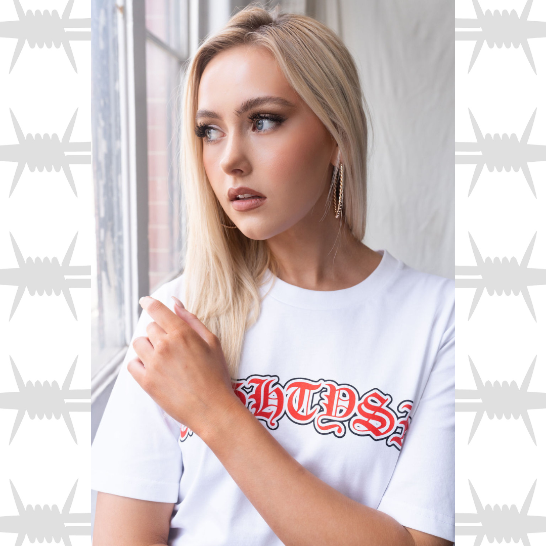 Old English Script T-shirt in white, worn by female alternative lifestyle model