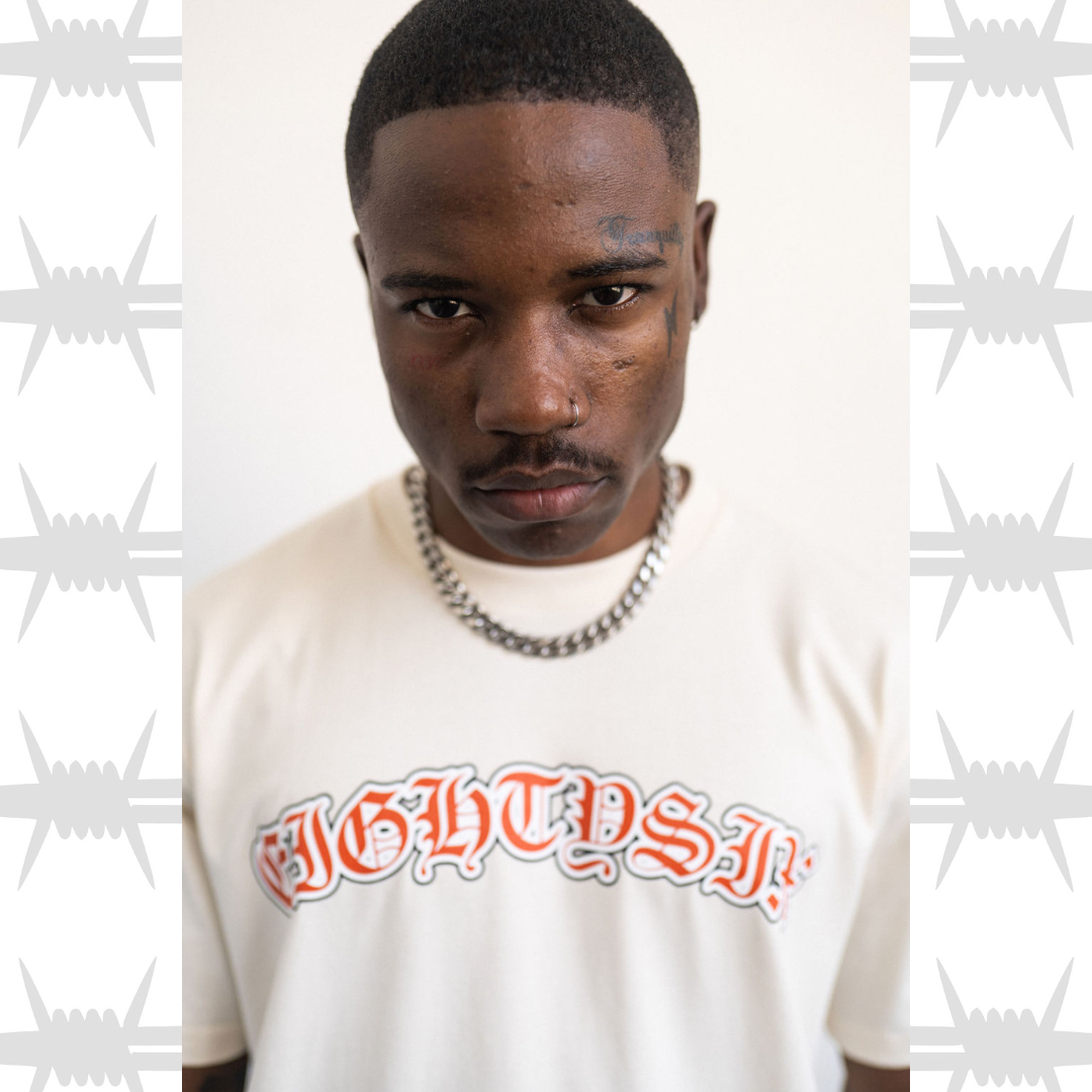 Old English tattoo script tshirt in ecru worn by tattooed alternative model