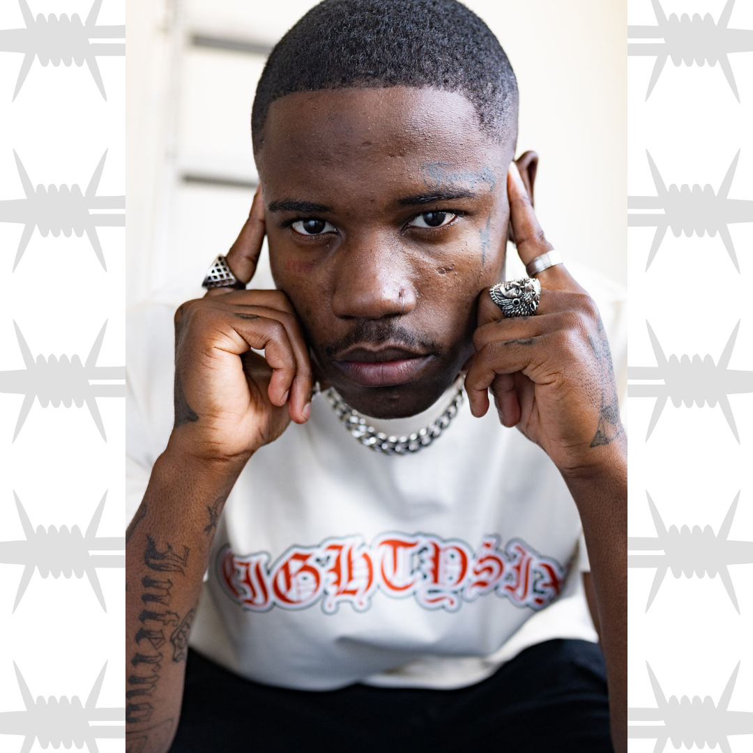 Old english tattoo script t-shirt in white worn by tattooed alternative model