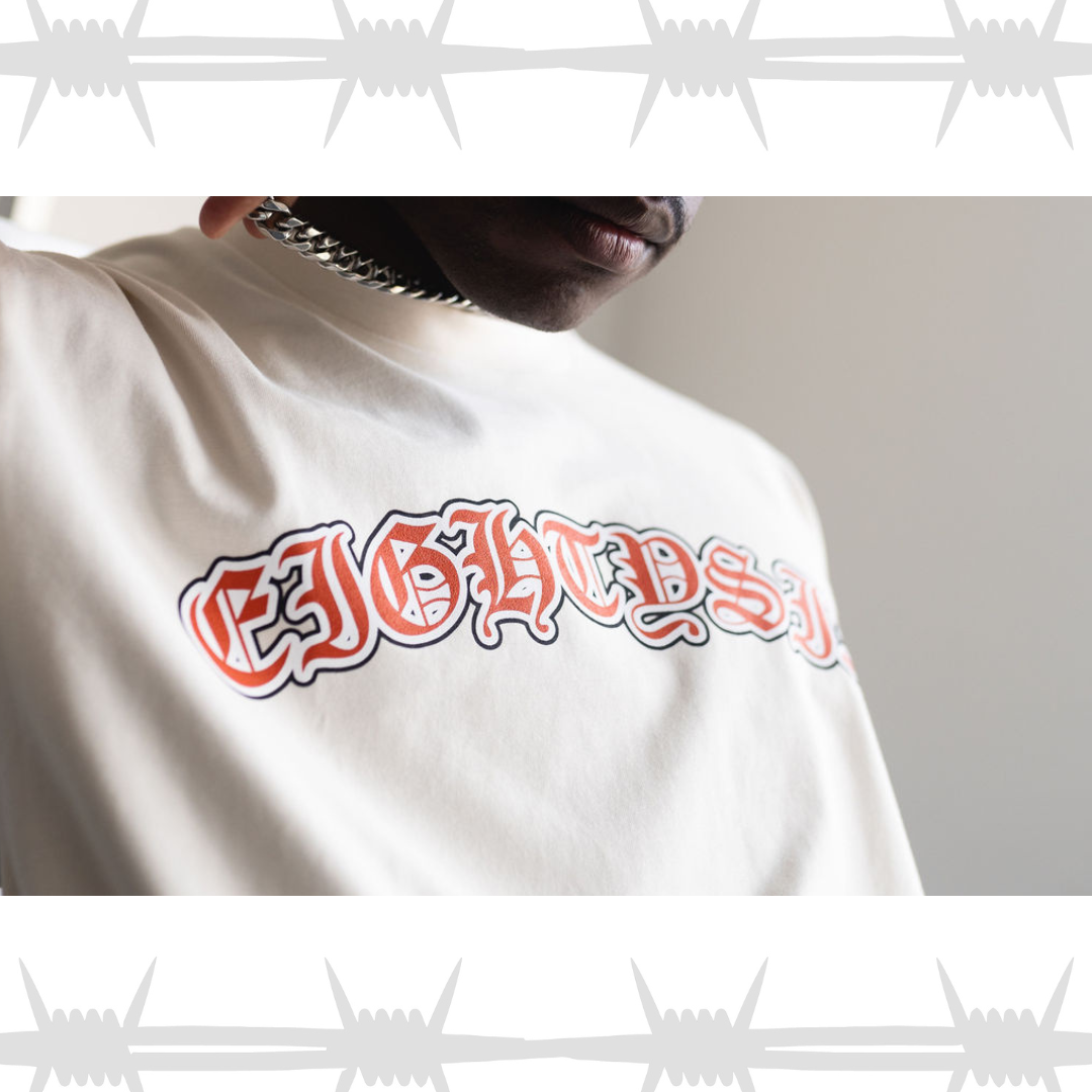 Old english tattoo script tshirt in white worn by alternative model
