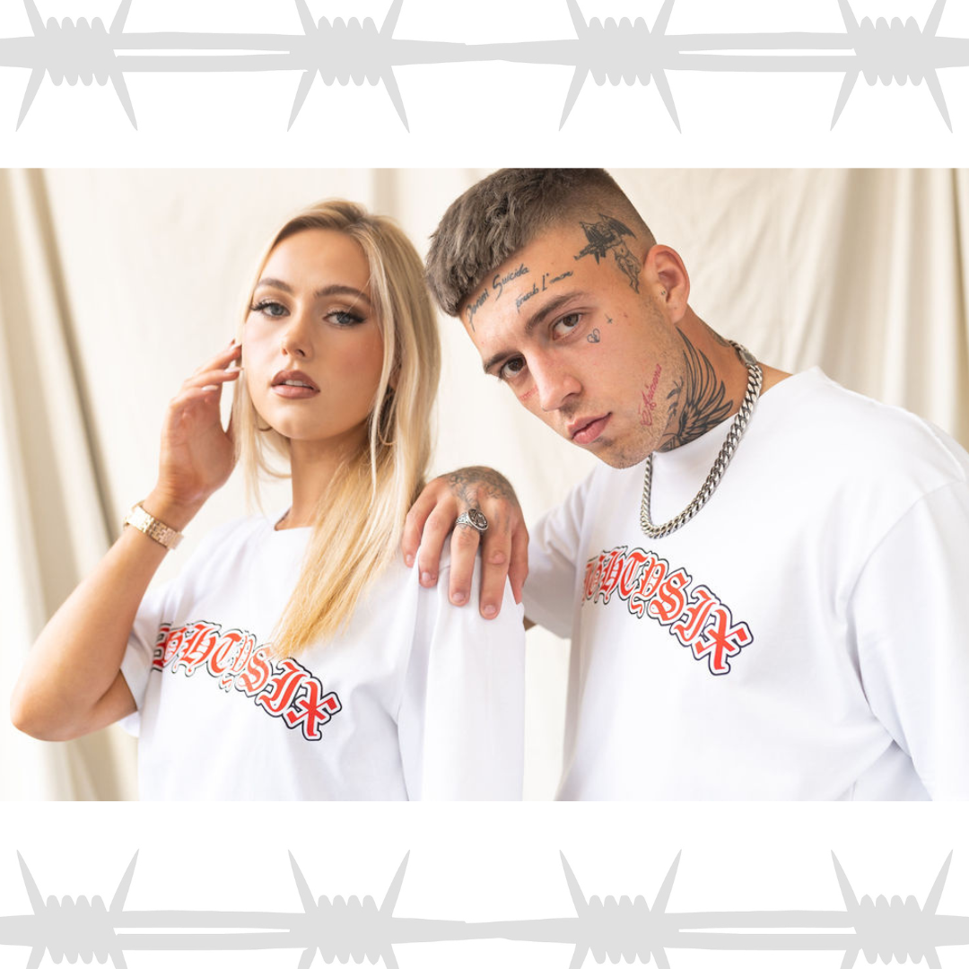 Old english script t-shirt in white worn by male and female alternative lifestyle models