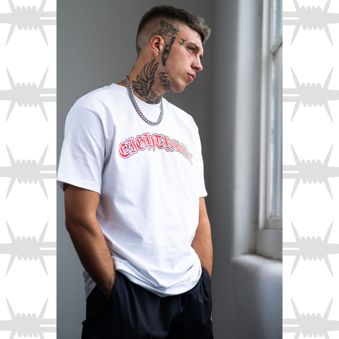 Old English tattoo script tshirt in white worn by alternative tattooed model