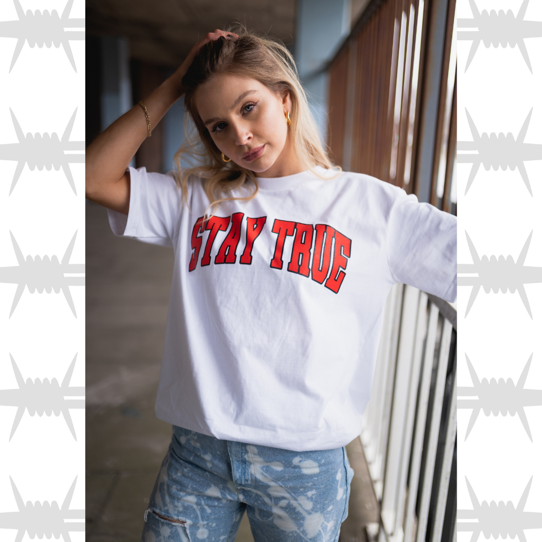 eightysix clothing Stay true varsity t-shirt in white worn by streetwear model