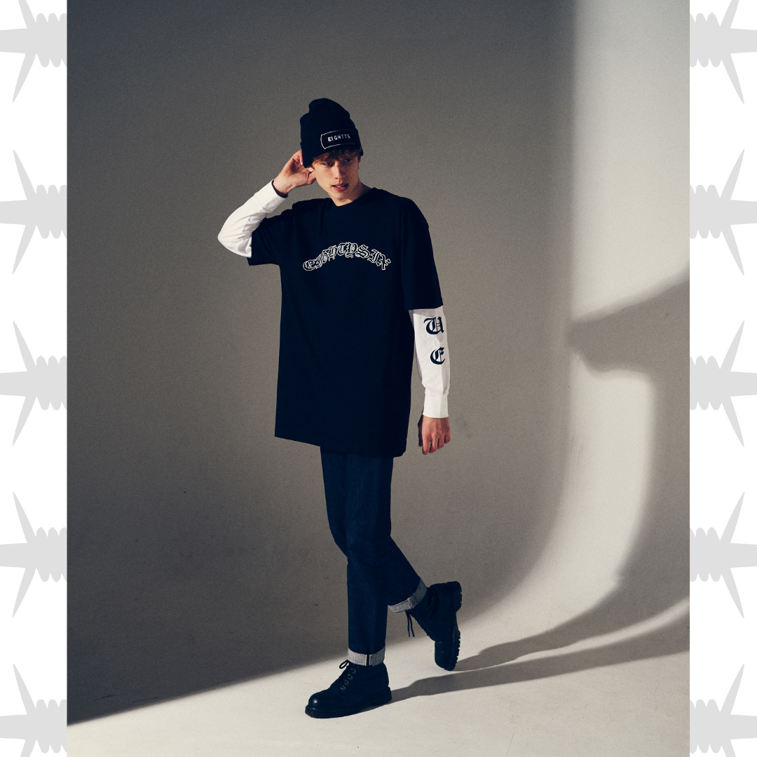 Old English tattoo script t-shirt in black with white script worn by tattooed alternative model