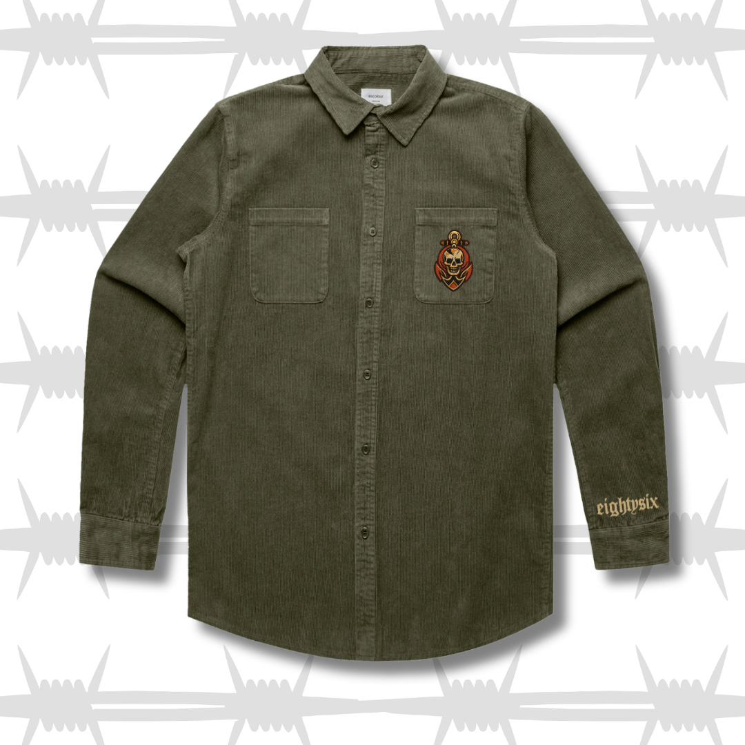 moss green workwear cord button up shirt with a tattoo inspired skull and anchor design