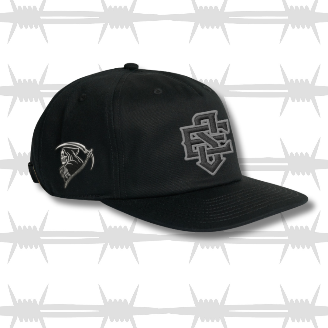 Black baseball cap with embroidered ES Logo and tattoo inspired reaper designs in grey