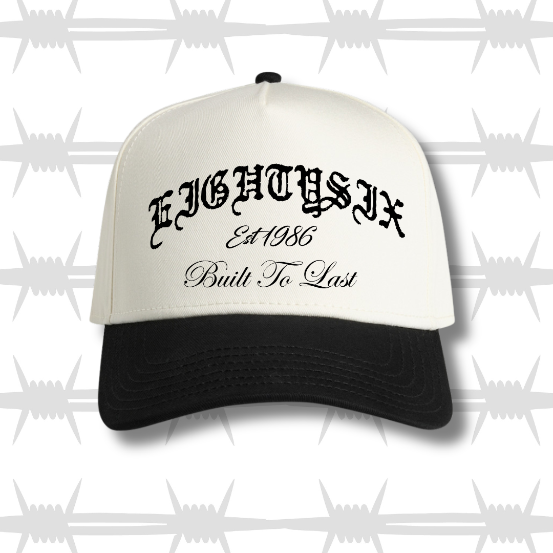 two tone cap with black peak featureing the eightysix logo and built to last script
