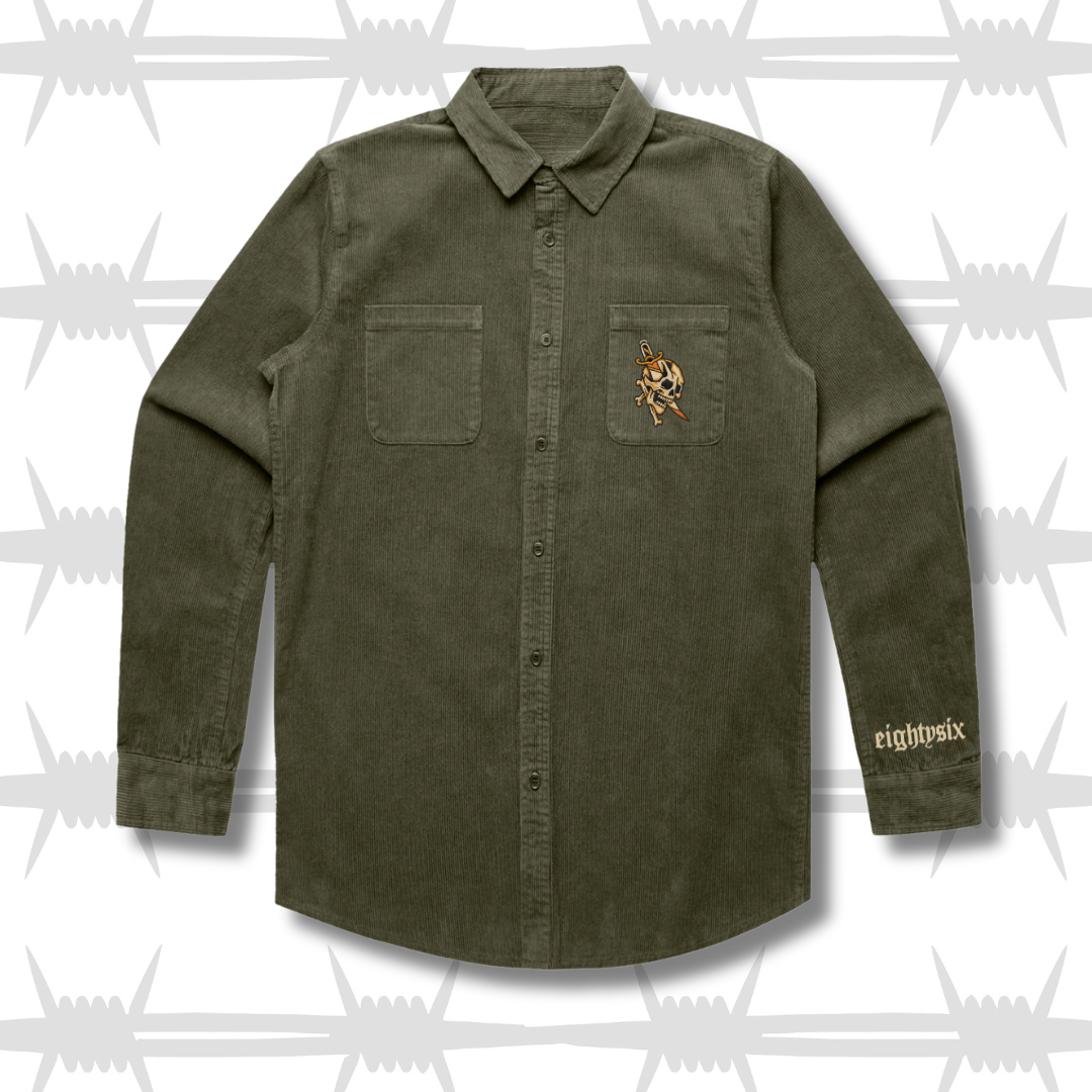 Green button-up workwear shirt with a tattoo inspired dagger and skull on the pocket