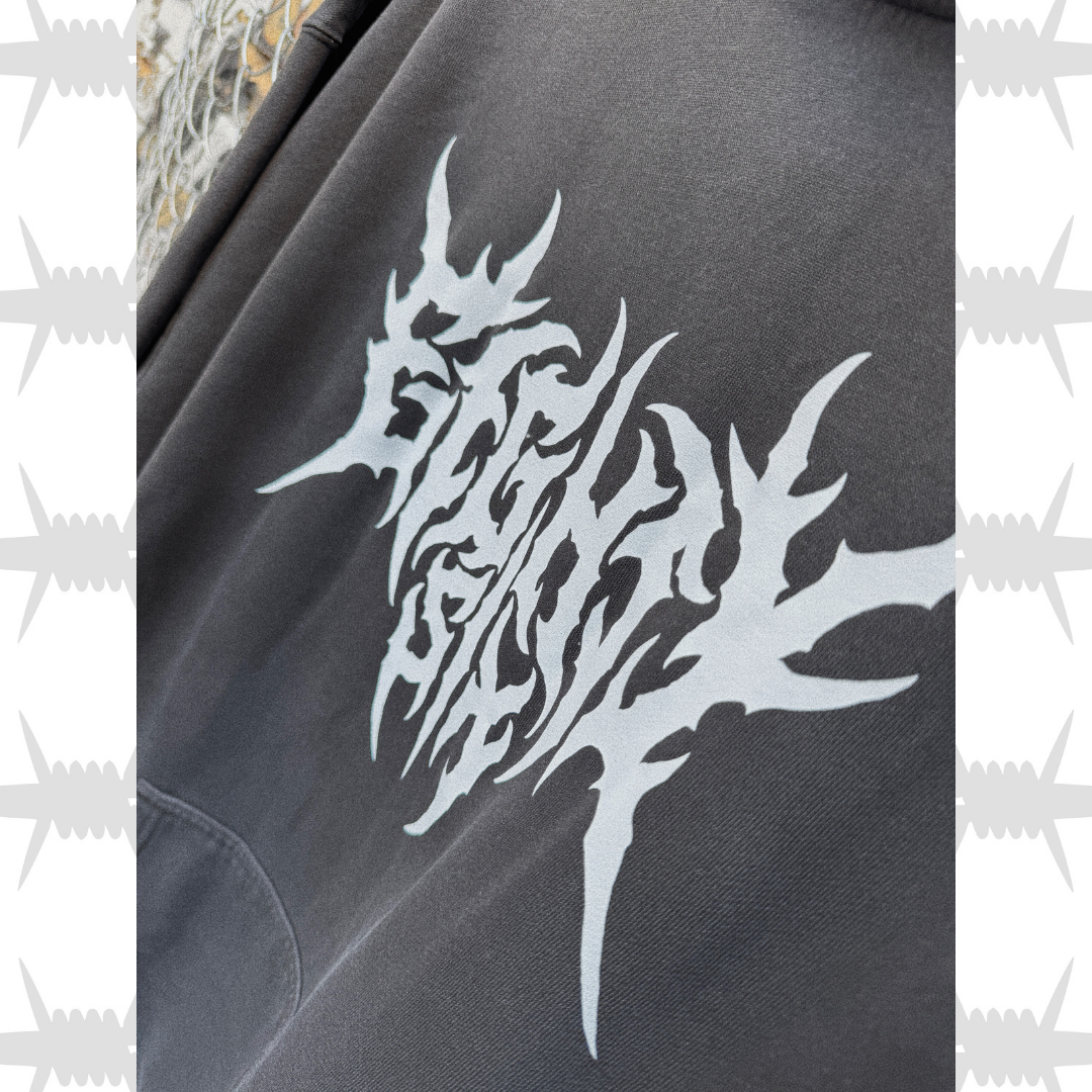 Close up of the eightysix clothing crypt hoodie in black with white metal script