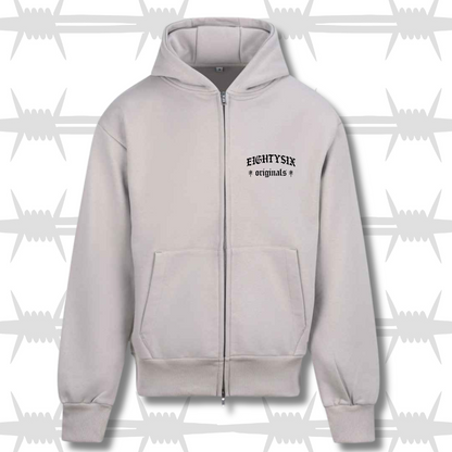 The originals zip hoodie in White with a Black embroidered eightysix originals logo on the left breast