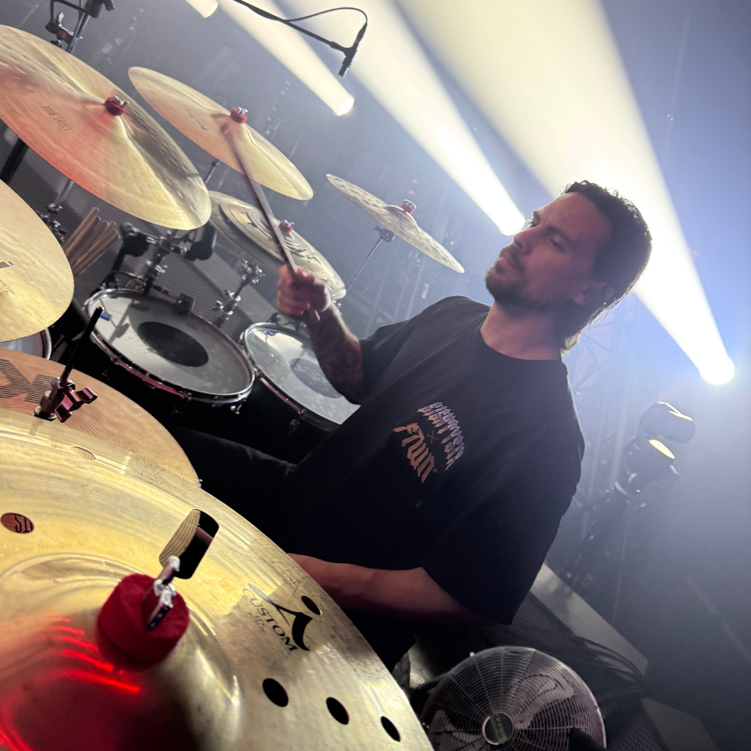 Eightysix X Flinttown t-shirt front shot worn by the drummer from You Me At Six while playing the drums at a gig