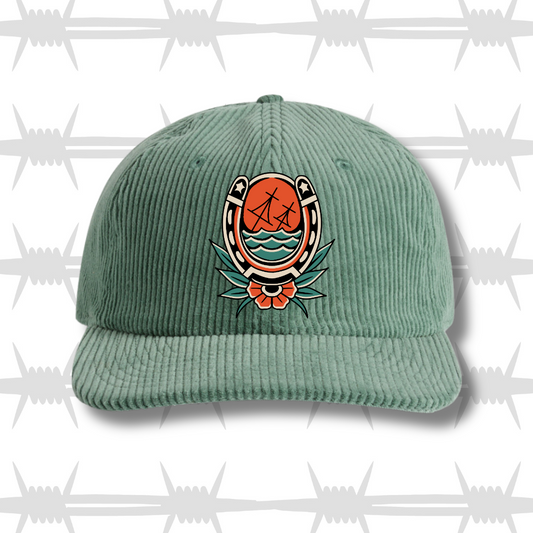 Cord Cap in sage green with traditional tattoo style horse shoe and sinking ship design