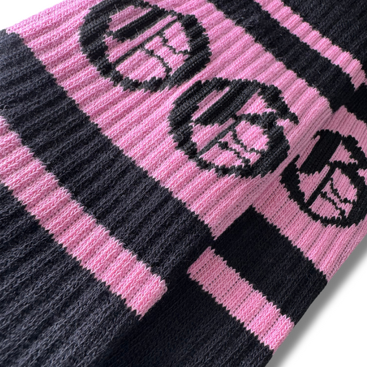 Black socks with 3 bubblegum pink stripes and a black OG logo 