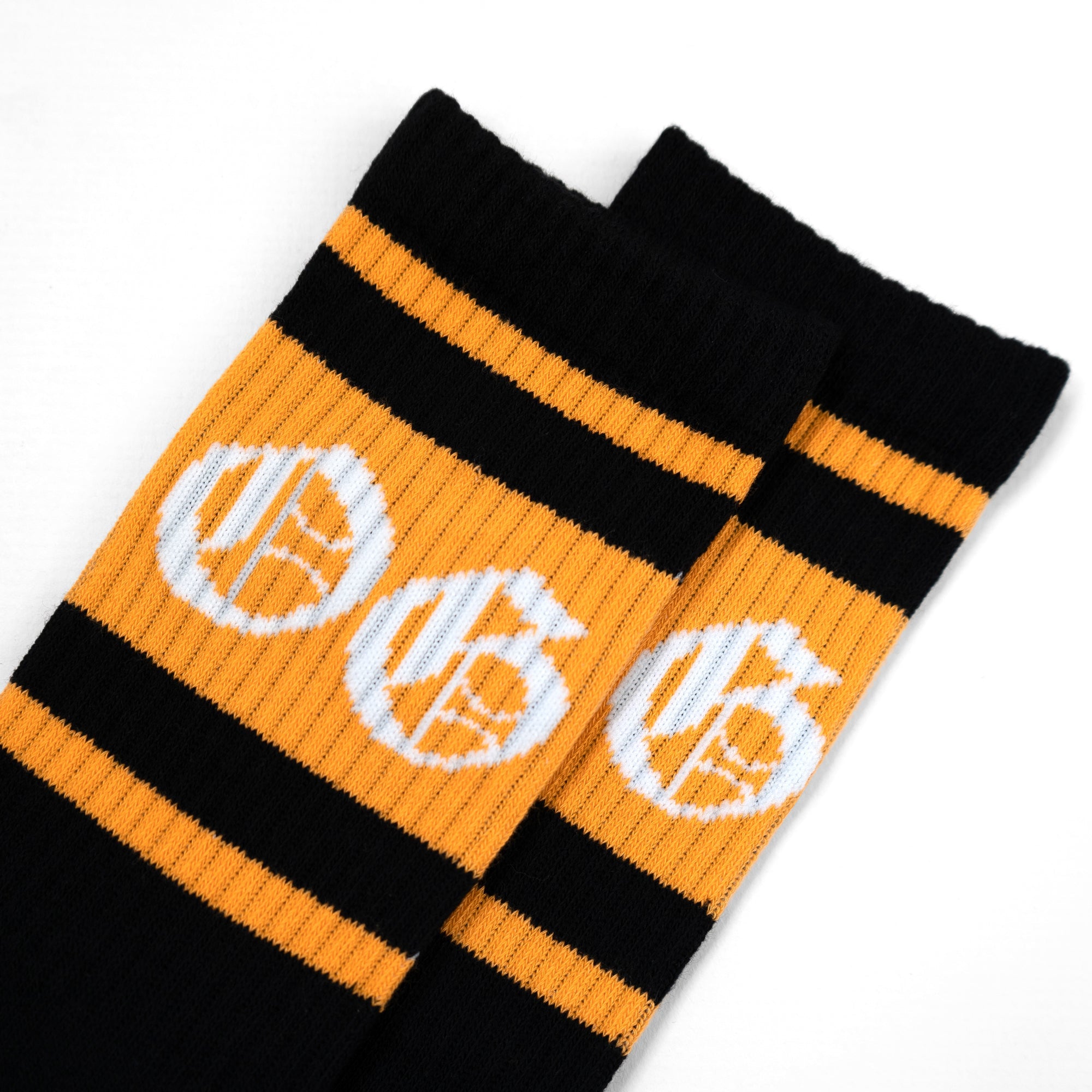 black OG sock with tangerine stripe and OG logo