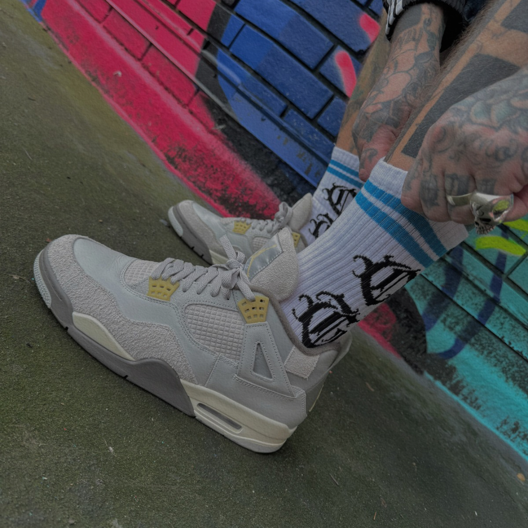 White og sock with two blue stripes and OG logo written in old english