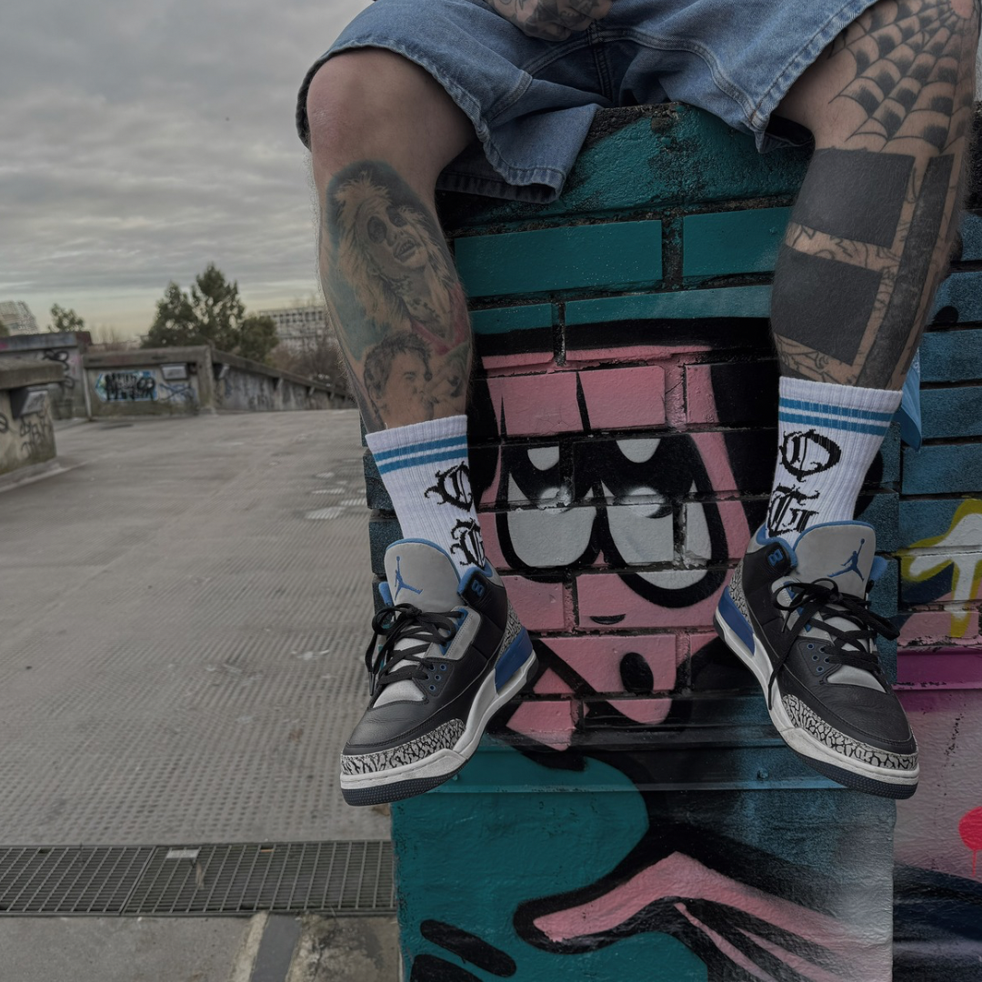 White og sock with two blue stripes and OG logo written in old english