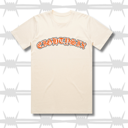 Old English Tattoo script t-shirt in ecru with orange script