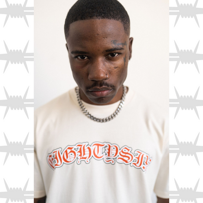Old English tattoo script tshirt in ecru worn by tattooed alternative model