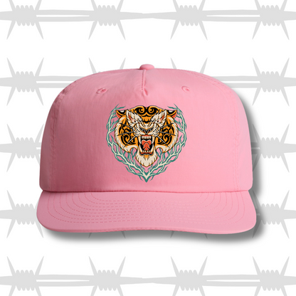 Bubblegum pink surf cap with a traditional tattoo style tiger design in center