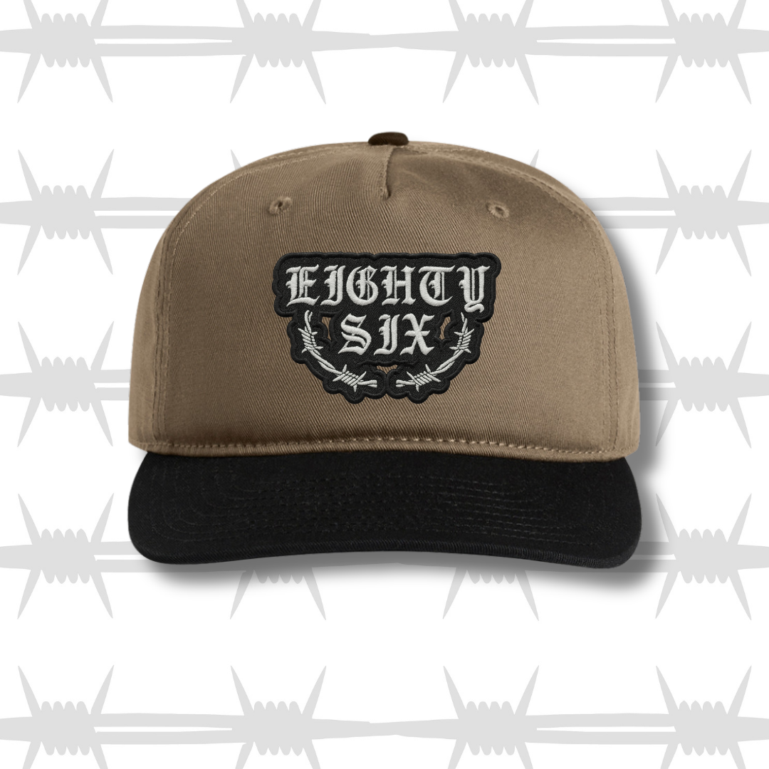 Two tone black and brown cap with embroidered eightysix logo with a barbed wire accent front shot