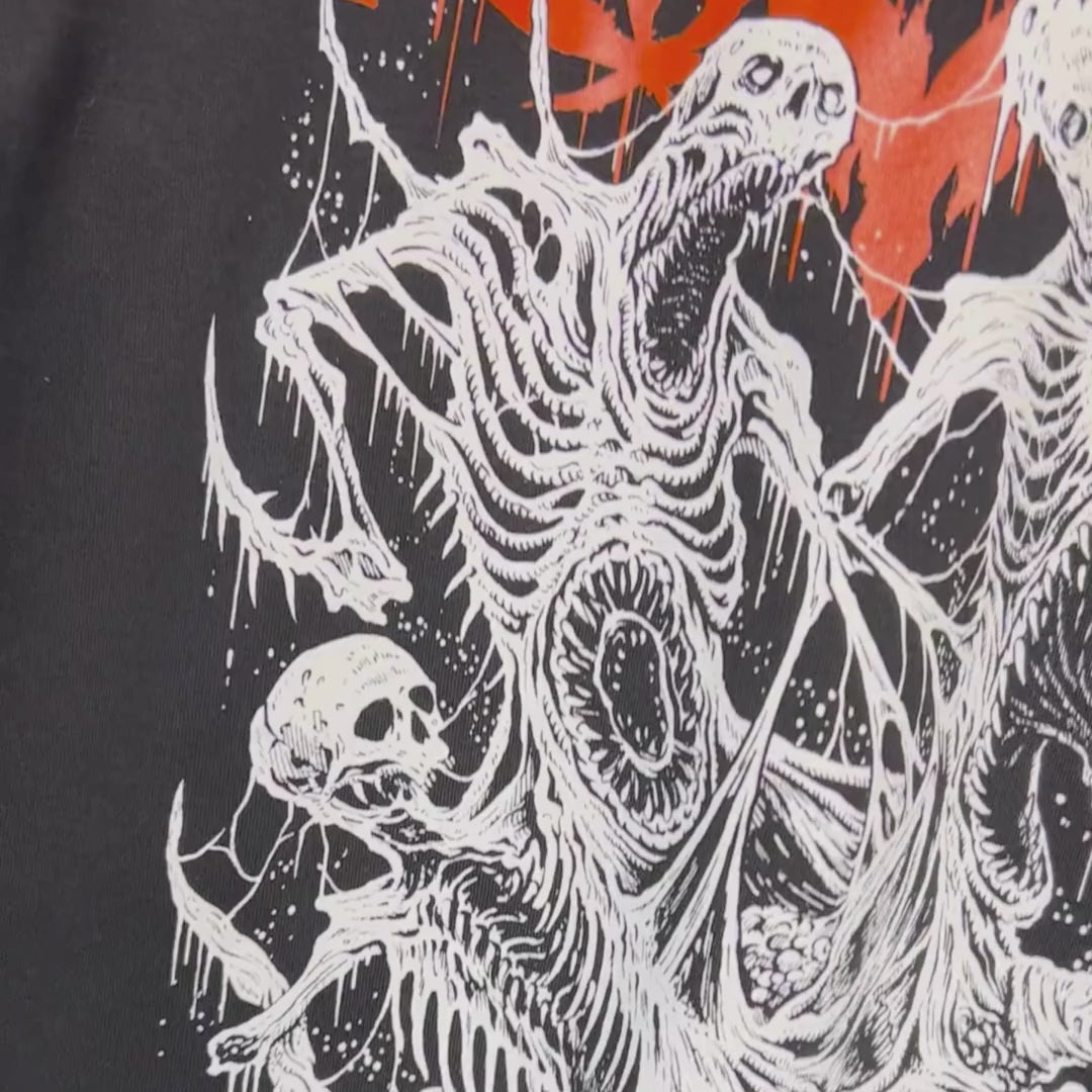 Close up video displaying the back image of the death metal hoodie, video shows eightysix heavy metal script logo in orange with four white demons fighting
