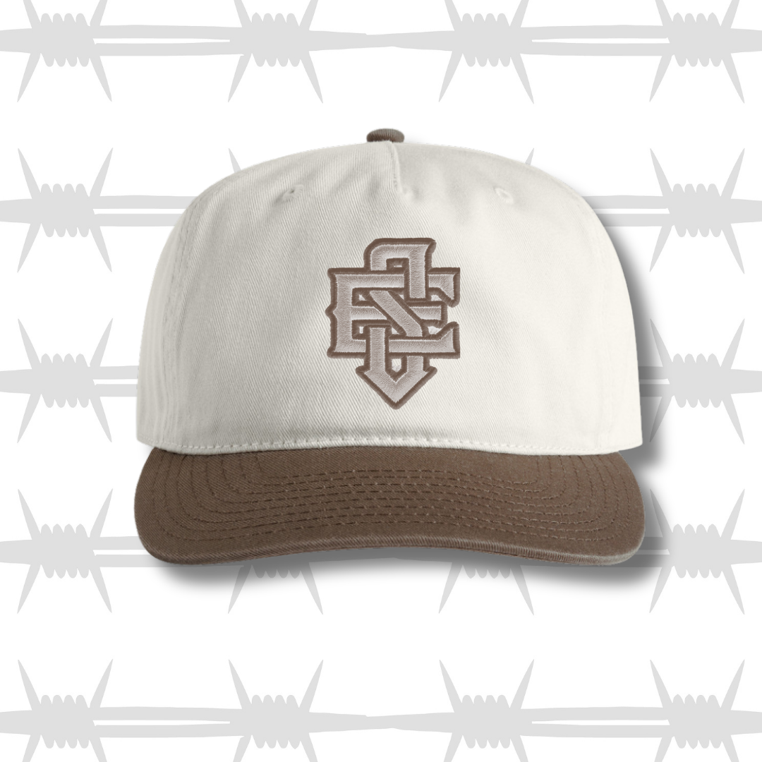 Black and white two tone cap with embroidered ES logo and tattoo inspired reaper design front shot