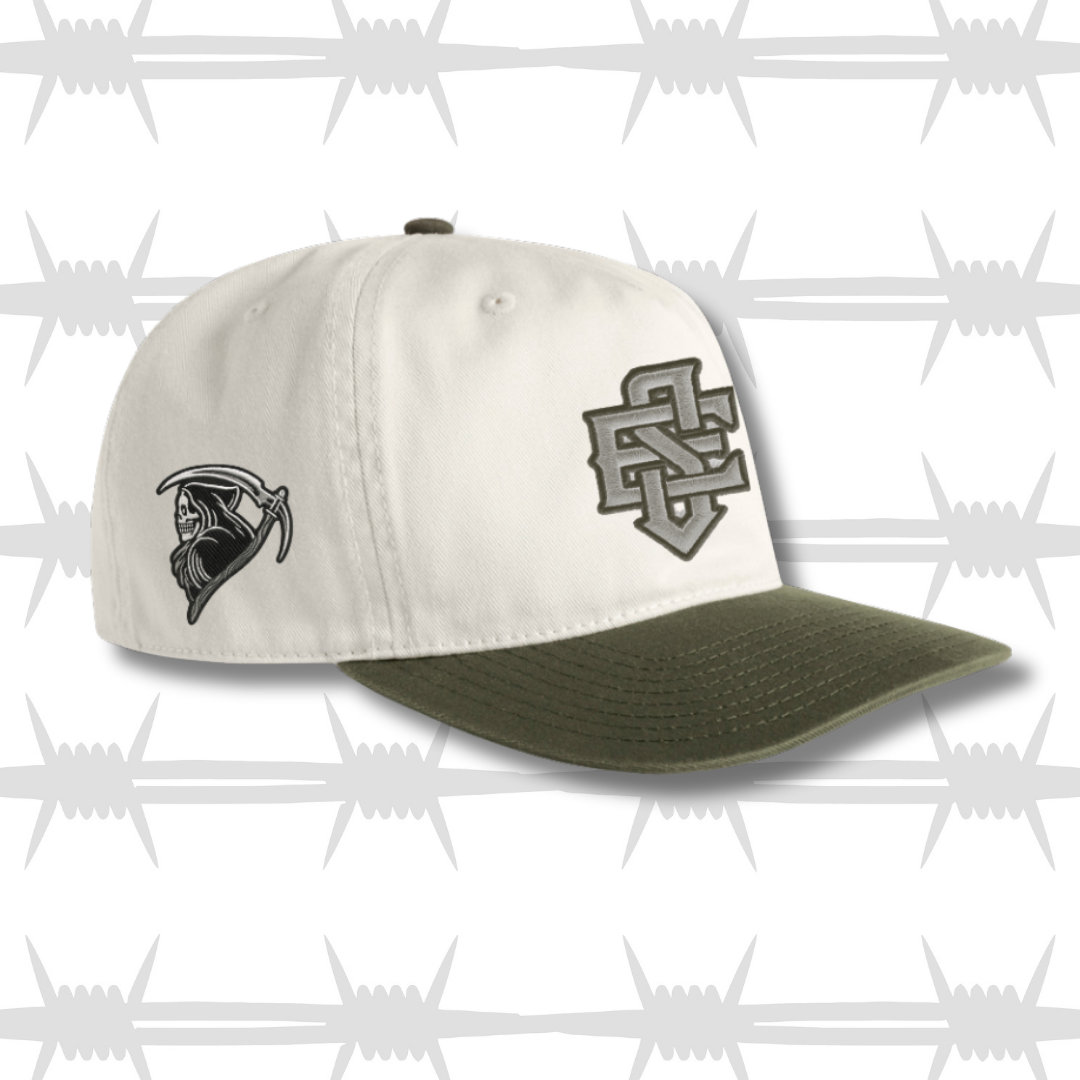 Grren and white two tone cap with embroidered ES logo and tattoo inspired reaper design on the side
